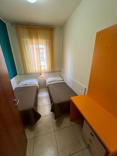 מיטה או מיטות בחדר ב-Appartamenti Levante - Agenzia Cocal