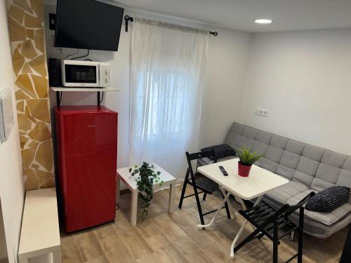 a living room with a couch and a table at Checkmate in Tolox