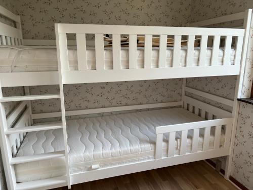 a white bunk bed in a childs room at Sea view house - all year round in Frørup