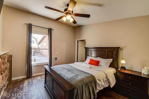 a bedroom with a bed and a ceiling fan at *H* NEW! 4BR Garden of the Gods Retreat in Colorado Springs