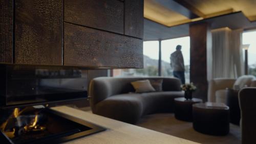 a living room with a couch and a chair and a table at No 14 Verbier in Verbier