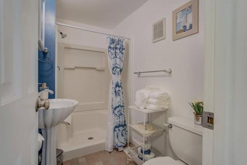 a bathroom with a sink and a tub and a toilet at 3BR DOWNTOWN - NEW Hot Tub - Olympic Training Center in Colorado Springs
