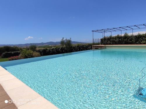 a large swimming pool with a clear blue water at Cintoia, Tuscany Beautiful villa with private pool in Santa Luce
