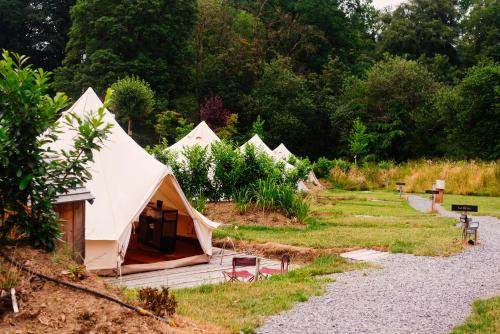 a group of tents in a garden at Le Domaine de Bra in Bra