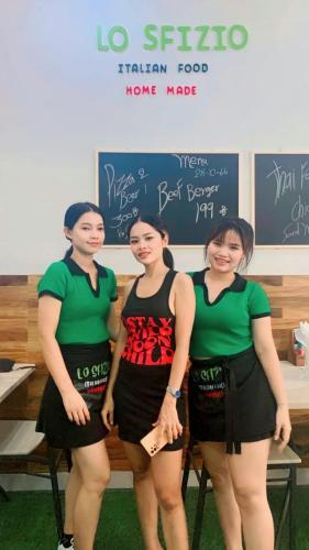 a group of three women standing in front of a classroom at Lo Sfizio in Patong Beach