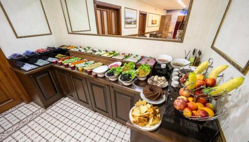 a buffet with many different types of food on a table at Bender Hotel in Istanbul