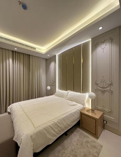 a bedroom with a large white bed in a room at fin apartment C6 in Riyadh