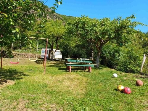 a park with a picnic table and a playground at Omni S Apartments in Bar