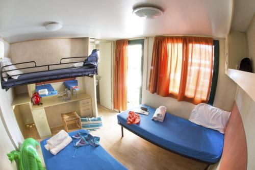a room with two bunk beds in a house at Sporting Club Village in Mazara del Vallo