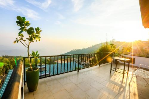 a balcony with a view of the water at Srilak View Holiday Inn in Haputale
