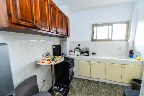 a kitchen with a counter and a sink in it at Dar Lamine Duplex in Rabat