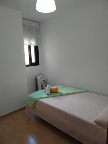 Postel nebo postele na pokoji v ubytování Habitación Ático Sol y Mar