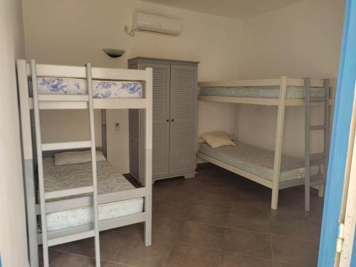 Ένα ή περισσότερα κρεβάτια σε δωμάτιο στο Villa Ulysse Djerba