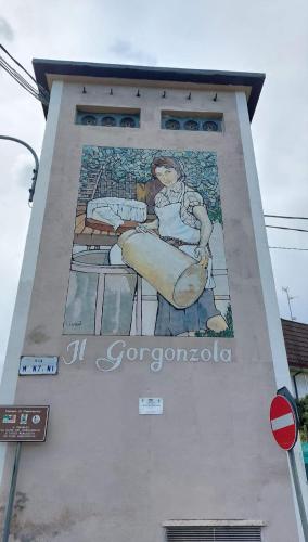 a large mural on the side of a building at Casa Valletta in Mezzomerico