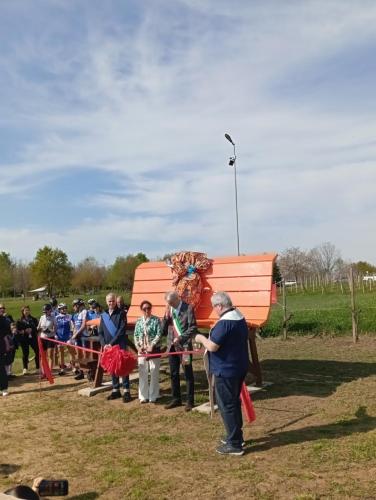 a group of people are cutting a ribbon at Casa Valletta in Mezzomerico