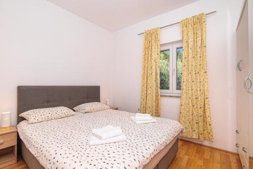 Postel nebo postele na pokoji v ubytování Apartman Sara