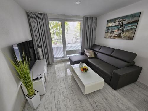 TV a/nebo společenská místnost v ubytování Apartmány Urban