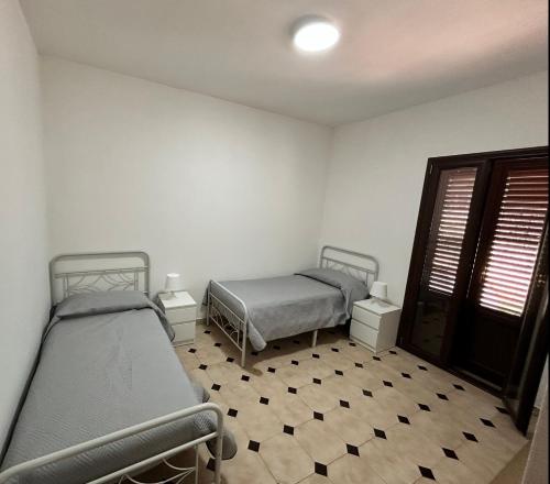 Ένα ή περισσότερα κρεβάτια σε δωμάτιο στο Villetta con giardino