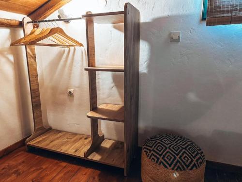 a wooden stair case in the corner of a room at Castaway's View Villa in Avlákia