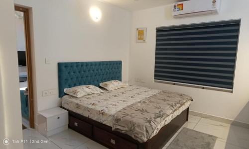 Voodi või voodid majutusasutuse Sreedhanya vantage point toas