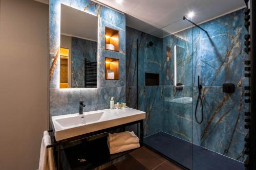 a bathroom with a sink and a shower at Hotel Touring in Bologna