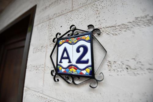 a sign on the side of a building at Villa Luxury Medjuvrsje in Međuvršje