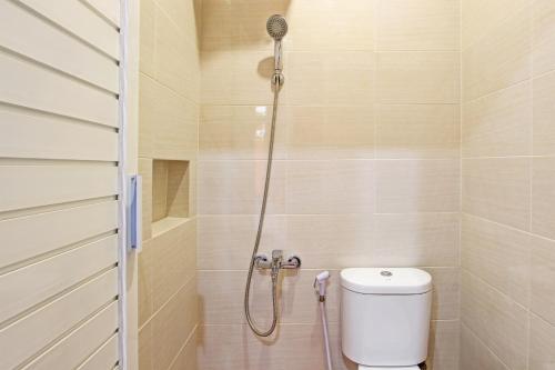 a shower stall with a toilet in a bathroom at OYO Life 93497 Griya Kost Rr in Salatiga