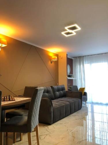 a living room with a couch and a table at Unique Apartment La Pineda in La Pineda