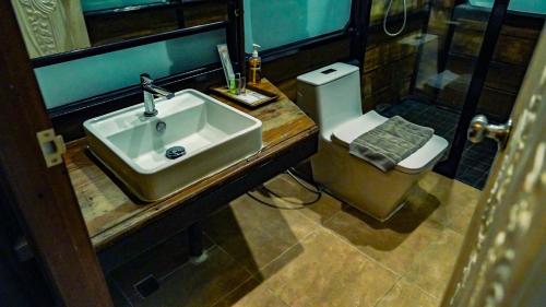a bathroom with a sink and a toilet at Letana Hotel in Bang Phli