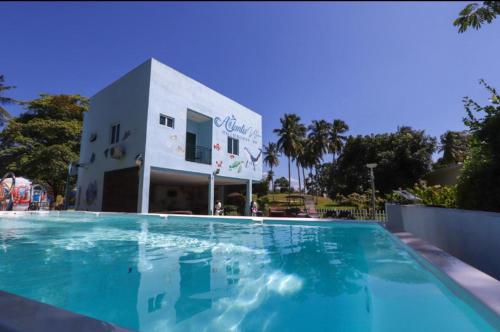 a large swimming pool in front of a building at Atlantis Villa Best homestay malaka in Kampong Alor Gajah