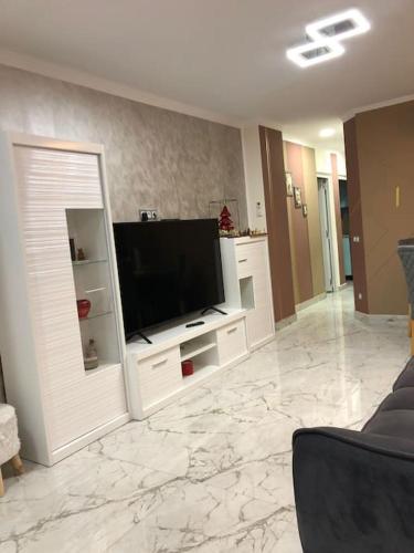 a living room with a flat screen tv on a wall at Unique Apartment La Pineda in La Pineda