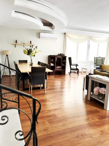 a living room with a table and a dining room at Villa Sophia Marmaris in Marmaris