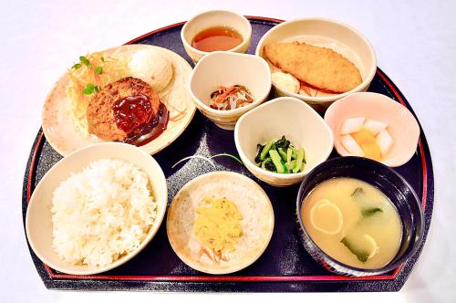 a tray of food with rice and different types of food at Okayama Universal Hotel Annex in Okayama