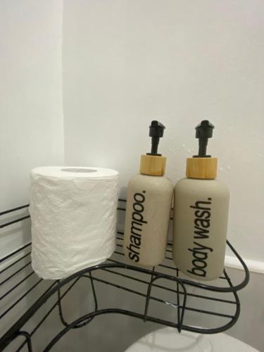 three rolls of toilet paper sitting on a rack at Isla Casita Homestay Siargao in General Luna