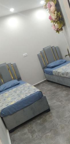 Ένα ή περισσότερα κρεβάτια σε δωμάτιο στο sweet home
