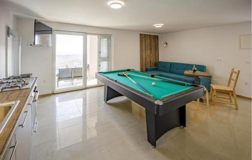 a living room with a pool table in it at Beautiful Home In Jastrebarsko in Jastrebarsko