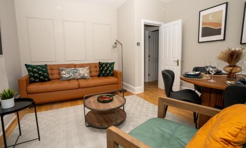 a living room with a couch and a table at Cosy Central London Flat - Covent Garden - Oxford Street in London
