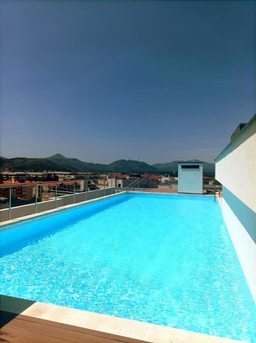 a large swimming pool on top of a building at Holiday in Trebinje Apartment in Trebinje