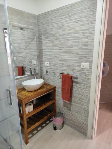 a bathroom with a sink and a shower at Holiday house Chiara in Giardini Naxos