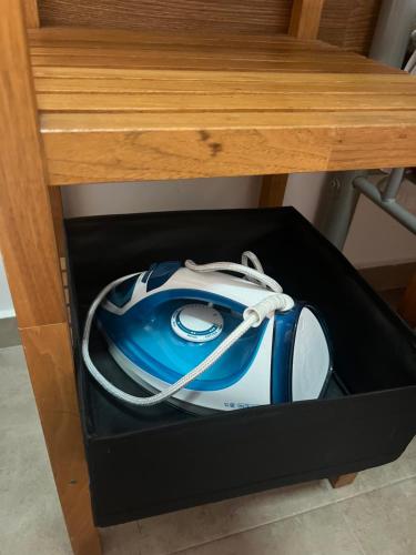 a computer mouse in a box under a desk at Cozy room next to el prat airport in El Prat de Llobregat