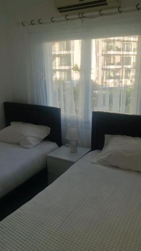 Säng eller sängar i ett rum på Aphrodite beachresort apartments