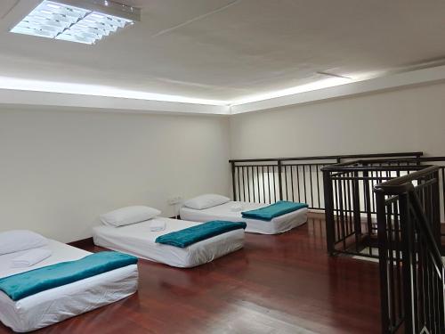 Cama o camas de una habitación en Maytower Apartment