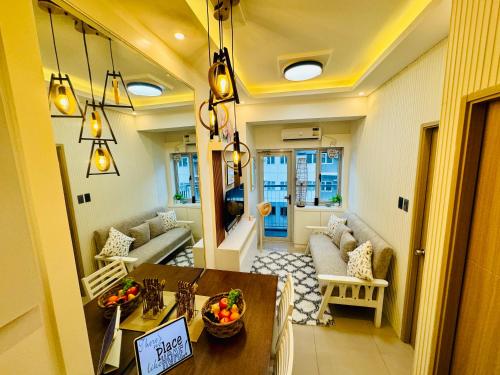 a living room with a table and a couch at SMDC Vine Residences Condo in Manila