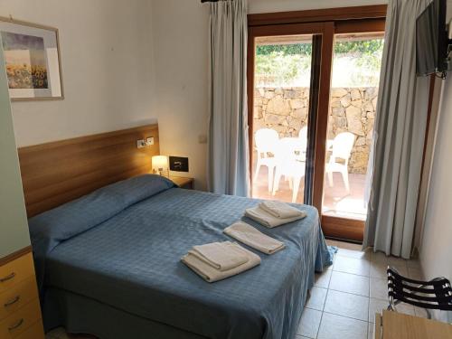 Postel nebo postele na pokoji v ubytování Hotel Porto Puddu - Il Nido dei Gabbiani