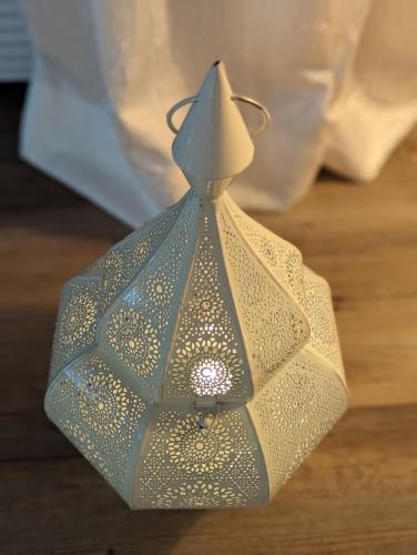 a glass lamp with a glass top on a table at Haus Grünewald Unsleben in Unsleben