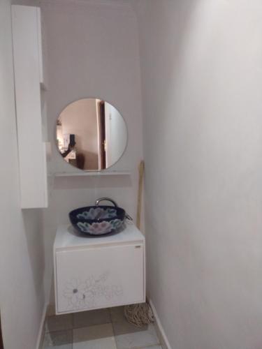 a mirror on top of a dresser in a bathroom at Precious Home stays in Maragoli