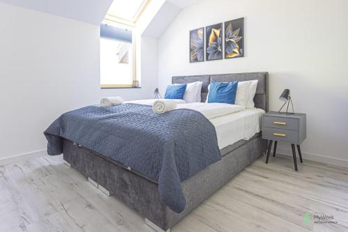 Voodi või voodid majutusasutuse Wichrowe Wzgórza, MyWeek toas