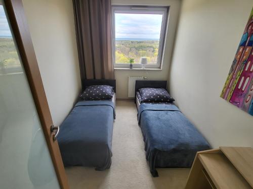 Una cama o camas en una habitación de Horyzont