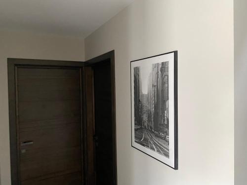 a picture hanging on a wall next to a door at Trakų Namelis in Trakai
