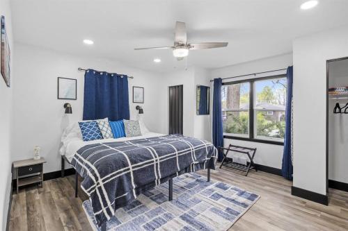 a bedroom with a bed and a ceiling fan at Roomy Retreat-Family & Friends 2 King Bed Game Room in Chesterton